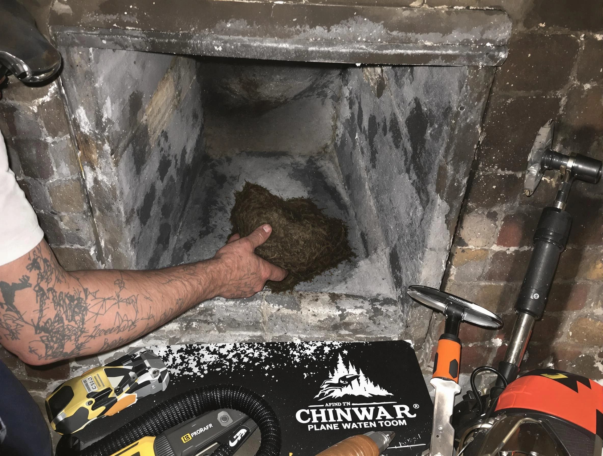 Burlington Chimney Sweep safely removing debris and screening chimney in Burlington, MA